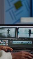 African videographer working at laptop from business office, editing and audio footage at night. Content creator using professional device modern technology network wireless processing film montage. video