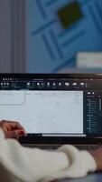 African engineer constructor designer architect analysing new bluilding plan in CAD program working in business office. Industrial woman employee studying prototype idea showing cad software on device display video