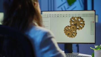 Focused woman architect working at new project using computer doing overtime at night sitting at desk in start-up office. Industrial female engineer studying on pc showing cad software in midnight video