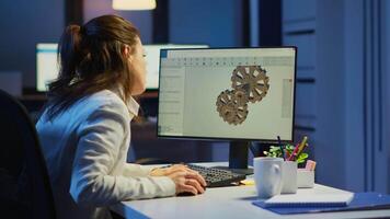 Tired woman architect working on modern cad program overtime sitting at desk in start-up office. Industrial female engineer studying prototype idea on pc showing cad software on device display video