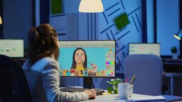 Freelancer retoucher woman working overtime on laptop computer with photo editing software. Professional graphic editor retouching photos of a client during night time in home office on performance pc video