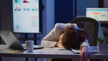 Freelancer working overtime on project falling asleep on desk with hand on financial documents trying to respect the deadline. Employee using modern technology network wireless, sleeping on table. video