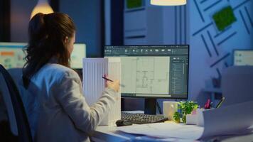 Engineer constructor designer architect creating new component in CAD program working in business office. Industrial woman employee studying prototype idea showing cad software on device display video