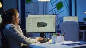 Woman engineer working late at night on a 3D model of industrial turbine drinking coffee in front of computer. Remote freelancer studying prototype idea on pc showing cad software on device display video
