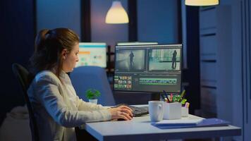 Videographer working at computer from business office, editing and audio footage at night. Content creator using professional device modern technology network wireless processing film montage. video