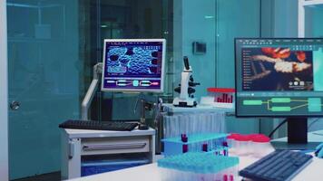 Group of scientists wearing lab coat working in laboratory while examining biochemistry sample in test tube and scientific instruments. Science technology research and development study concept. video