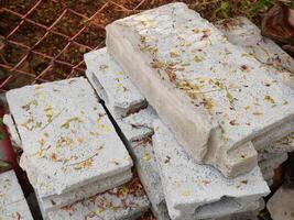 Cement brick blocks with fallen flower petals photo