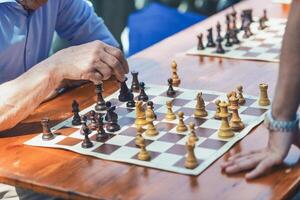 Chess moves of two players on the street photo