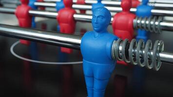 Football table or soccer table game with plastic player figurine. Mini Soccer game which famous in past and be collectable item for foosball lover. Play by two hand control each row of player figurine photo