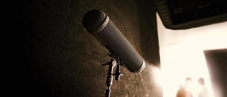 Boom Microphone on stand in Production which recording audio and ambient sound in studio. photo