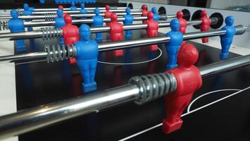 Football table or soccer table game with plastic player figurine. Mini Soccer game which famous in past and be collectable item for foosball lover. Play by two hand control each row of player figurine photo