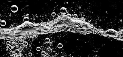 Soda water bubbles splashing underwater against black background. photo