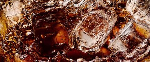 Cola soda and ice splashing fizzing or floating up to top of surface photo