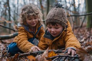 Children exploring the woods and collecting sticks near their campsite photo