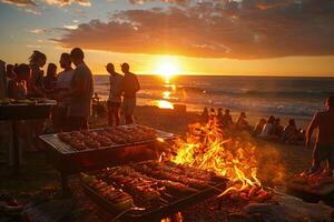 A group of people at a beach barbecue, cooking food over an open flame as the sun sets photo
