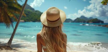 Woman Standing on Beach With Hat photo