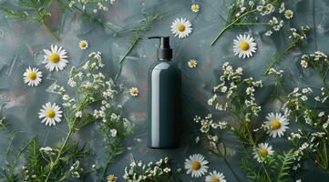 Bottle of Green Liquid Surrounded by Daisies photo