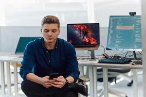 Programming. Man Working On Computer In IT Office, Sitting At Desk Writing Codes. Programmer Typing Data Code, Working On Project In Software Development Company photo