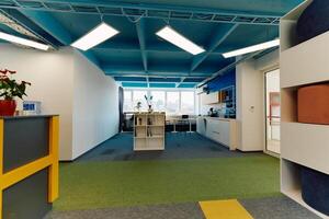Photo of a modern office where programming, digital marketing and web design projects are done. Office with modern furniture and glass office