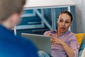 A modern programmer discussing future business projects with colleagues in a modern startup office photo
