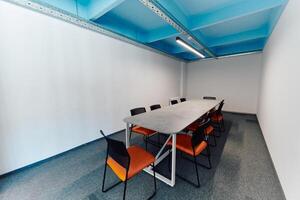 Photo of a modern office where programming, digital marketing and web design projects are done. Office with modern furniture and glass office