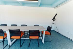 Photo of a modern office where programming, digital marketing and web design projects are done. Office with modern furniture and glass office