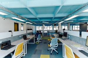 Photo of a modern office where programming, digital marketing and web design projects are done. Office with modern furniture and glass office