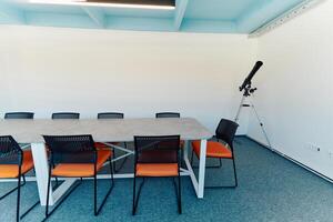 Photo of a modern office where programming, digital marketing and web design projects are done. Office with modern furniture and glass office
