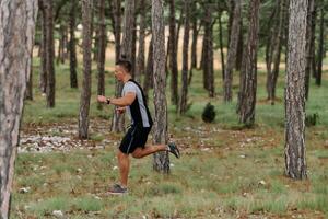 Determined Man Conquering Forest Obstacles with Grit and Speed photo