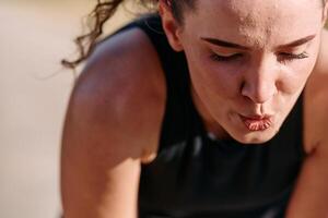 Woman Resting After Intense Run photo