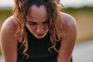 Woman Resting After Intense Run photo