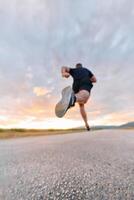 Sunset Runner Embracing the Serenity of Dusk with Every Stride photo