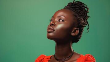 Woman With Dreadlocks in Front of Green Wall photo