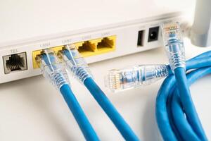 Ethernet cable with wireless router connect to internet service provider internet network. photo