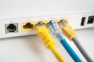 Ethernet cable with wireless router connect to internet service provider internet network. photo
