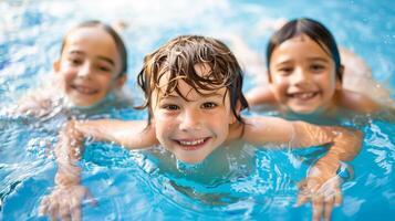 Children learn swimming underwater in pool for kid. photo