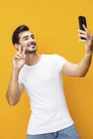 Man communication smiling smartphone copy mobile technology cyberspace happy studio phone space portrait yellow phone photo