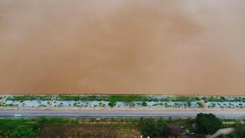 Aerial view of beautiful view of the mighty Mekong River with fishing boats passing by at the border of Thailand and Laos, Chiang Rai Province, Thailand. photo