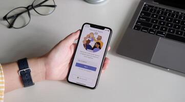CHIANG MAI, THAILAND - JULY 3, 2020 . A working from home employee is downloading the Microsoft Teams social platform, ready for remote working in isolation from home. photo