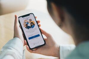 CHIANG MAI, THAILAND - JULY 26, 2020 . A working from home employee is downloading the Microsoft Teams social platform, ready for remote working in isolation from home photo