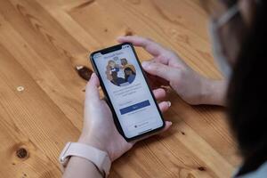 CHIANG MAI, THAILAND - NOV 14, 2021 . A working from home employee is downloading the Microsoft Teams social platform, ready for remote working in isolation from home. photo