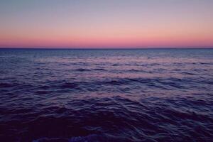 Serene ocean waves under pastel twilight sky photo