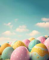 Painted colorful Easter eggs on a background of blue sky with clouds, Happy Easter day concept and idea, copy space photo