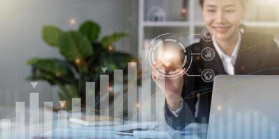 Businesswoman draw growth graph and progress of business and analyzing financial and investment data, development of success, business planning and strategy photo