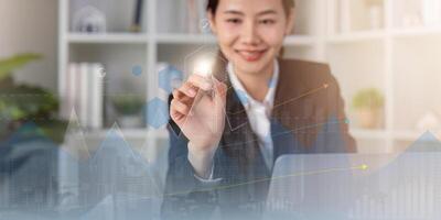 Businesswoman draw growth graph and progress of business and analyzing financial and investment data, development of success, business planning and strategy photo
