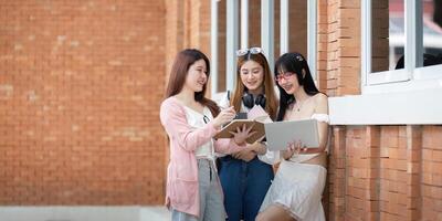 Asian young campus student enjoy learn study and reading books together. Friendship and Education concept. Campus school and university. Happiness and funny of learning in college photo