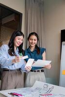 ux developer and ui designer presenting mobile app interface design on whiteboard in meeting at office. Creative digital development mobile app agency. digital transformation photo