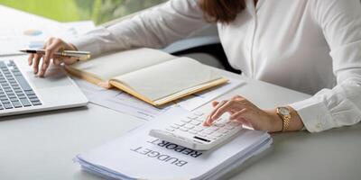 Interest rate and dividend concept businesspeople is calculating income and return on investment in percentage. income return retirement compensation fund, investment dividend tax stock market photo