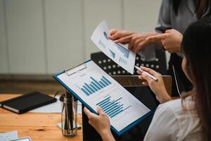Business team collaboration discussing working analyzing with financial data and marketing growth report graph in team, presentation and brainstorming to strategy planning making profit of company photo