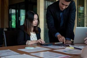 Business team discussing the charts and graphs showing the results at meeting accounting and financial photo